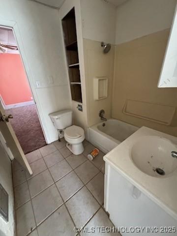 full bathroom featuring tile patterned flooring, vanity, bathtub / shower combination, and toilet