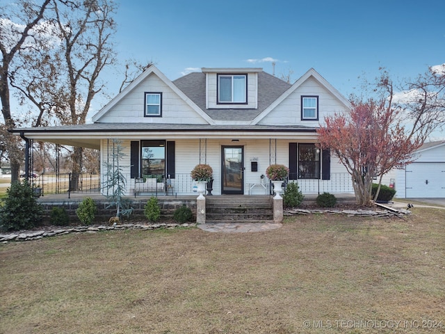 farmhouse with covered porch and a front yard