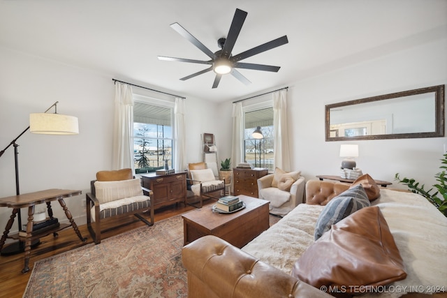 living room with hardwood / wood-style flooring, plenty of natural light, and ceiling fan