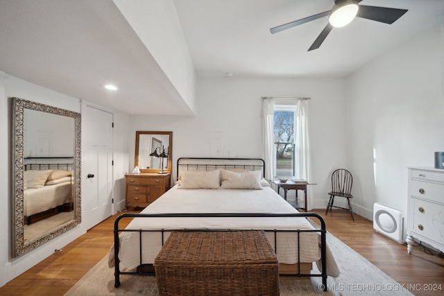 bedroom featuring hardwood / wood-style floors and ceiling fan