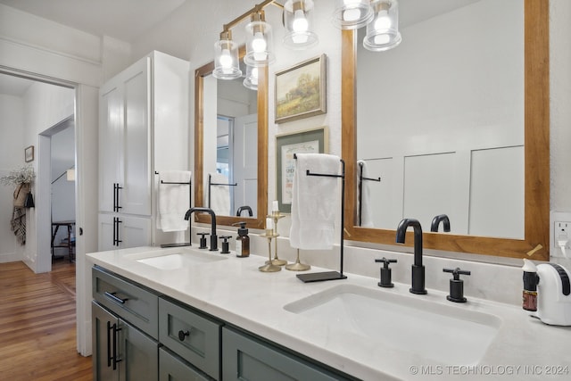 bathroom featuring hardwood / wood-style floors and vanity