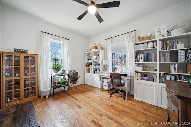 office area with ceiling fan and light wood-type flooring