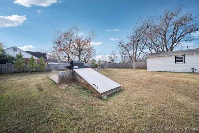 view of storm shelter featuring a yard