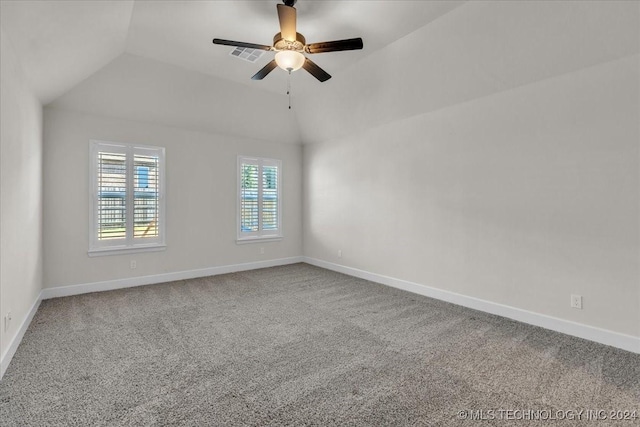 unfurnished room with ceiling fan, carpet floors, and vaulted ceiling