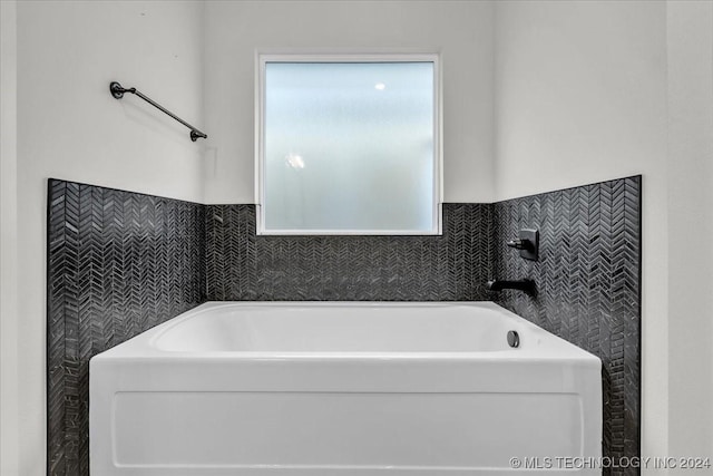 bathroom featuring a tub to relax in