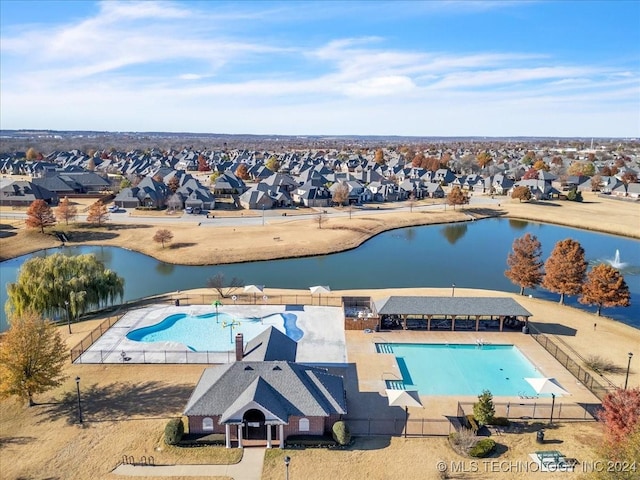 view of pool featuring a water view