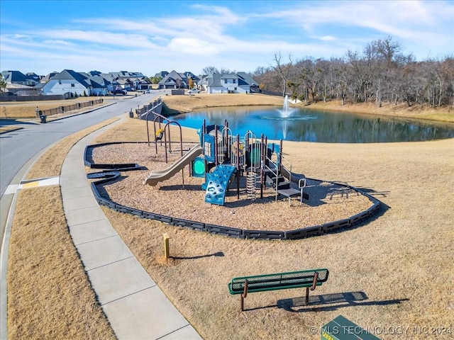 view of playground featuring a water view