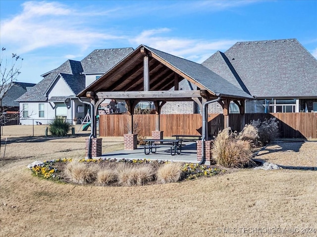 view of property's community with a gazebo and a patio area