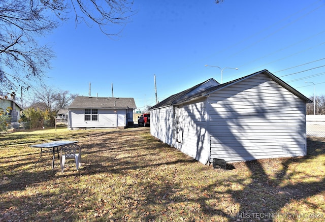 rear view of house featuring a yard