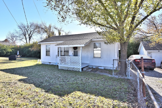 view of front of home featuring a front lawn and a porch