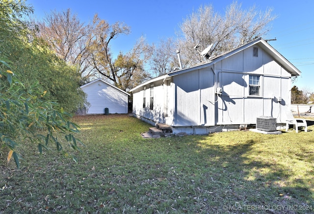 view of home's exterior featuring a lawn and cooling unit