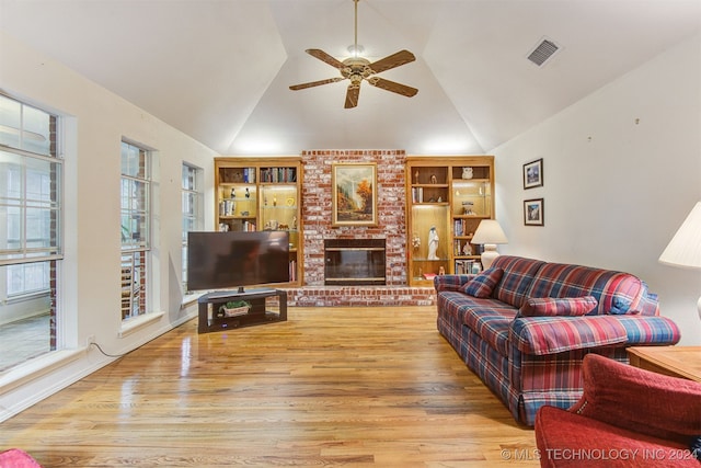 living room featuring light hardwood / wood-style flooring, ceiling fan, and lofted ceiling