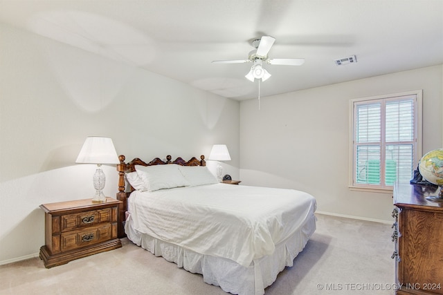 bedroom with light carpet and ceiling fan