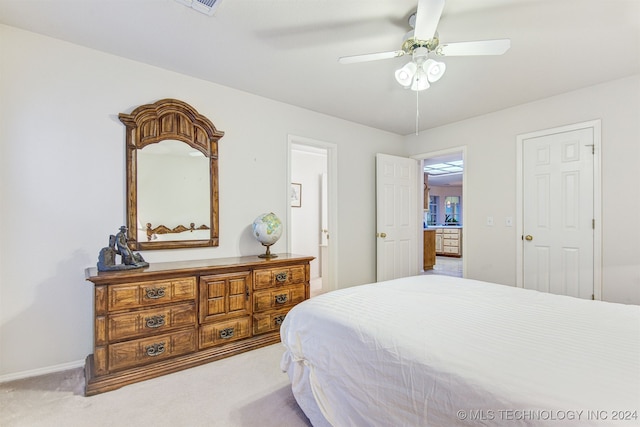 bedroom with ceiling fan and carpet