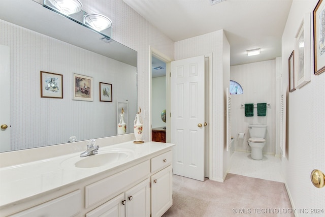 bathroom with vanity and toilet