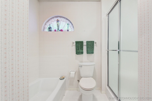 bathroom featuring tile patterned floors, separate shower and tub, and toilet