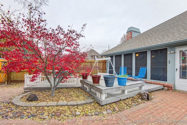 view of patio / terrace featuring a sunroom