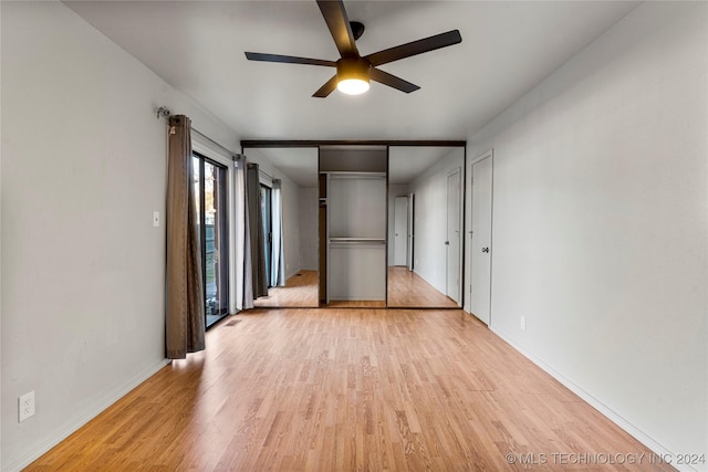 unfurnished bedroom featuring ceiling fan and light wood-type flooring