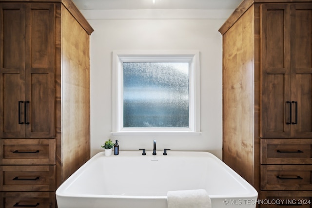 bathroom with a bathtub and sink