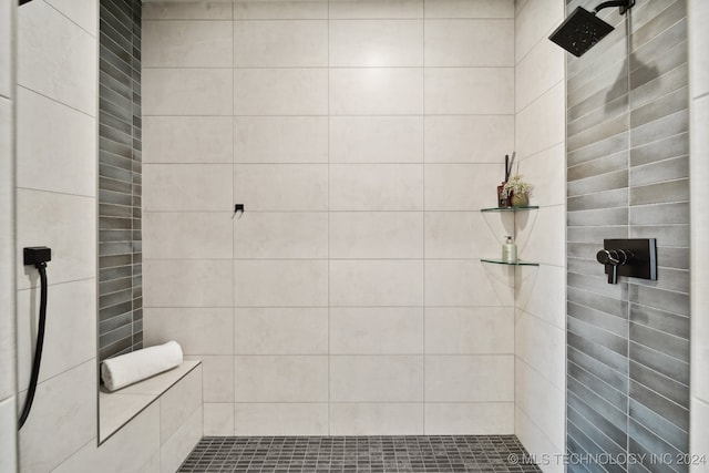 bathroom with a tile shower