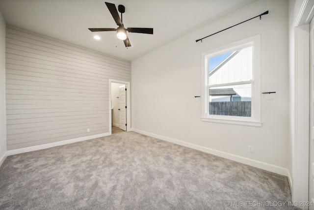 unfurnished bedroom featuring ceiling fan and light colored carpet