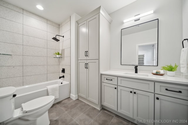 full bathroom featuring tile patterned floors, vanity, toilet, and tiled shower / bath