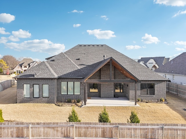 rear view of property featuring a patio area