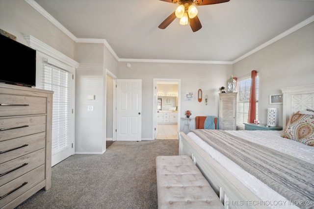 bedroom with carpet, ensuite bathroom, ceiling fan, and crown molding