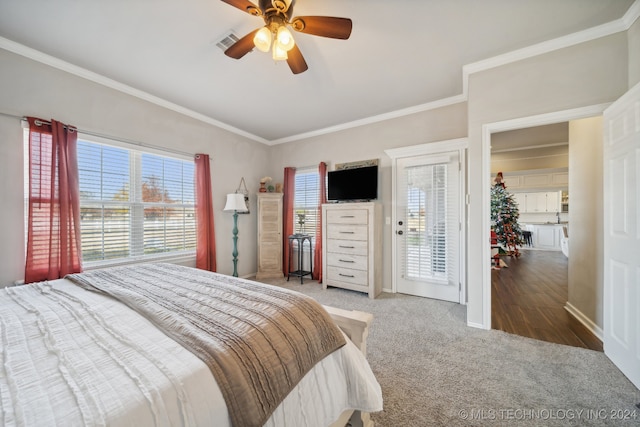 bedroom featuring hardwood / wood-style flooring, ceiling fan, ornamental molding, and access to outside