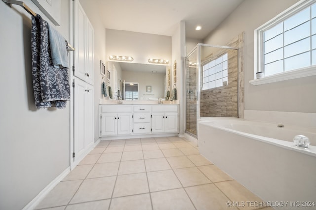 bathroom with shower with separate bathtub, vanity, and tile patterned floors