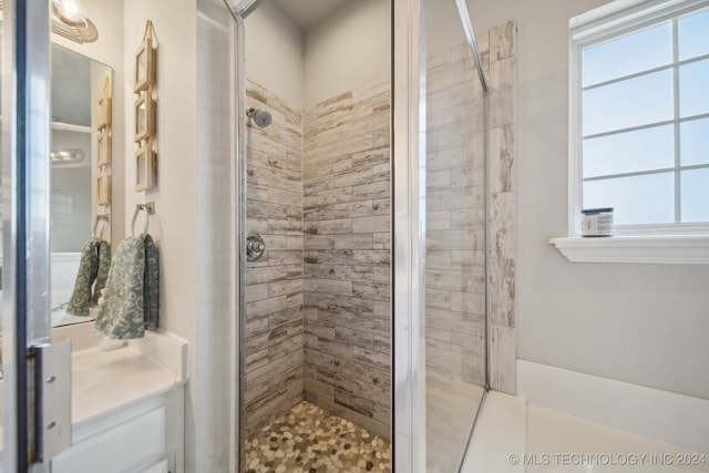 bathroom with vanity and walk in shower