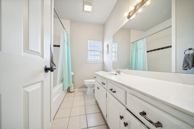 full bathroom with shower / bathtub combination with curtain, tile patterned flooring, vanity, and toilet