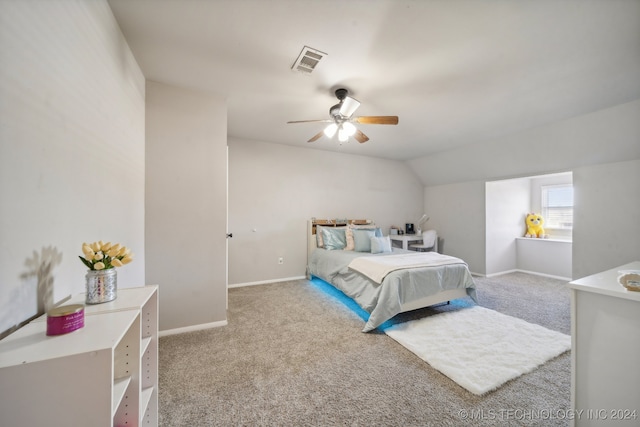 bedroom with carpet, ceiling fan, and lofted ceiling