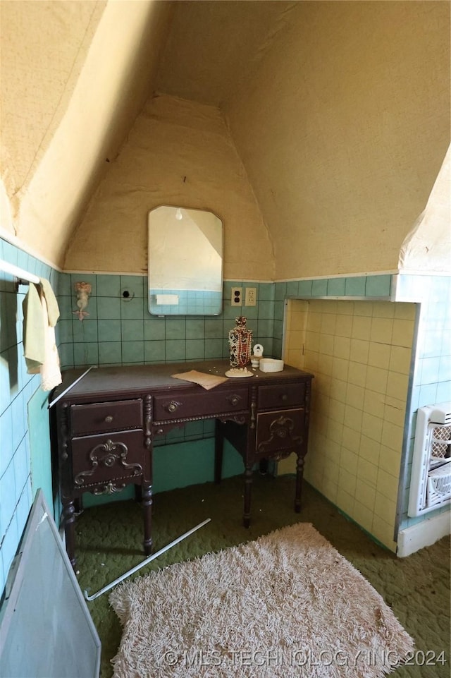 bathroom with tile walls and heating unit