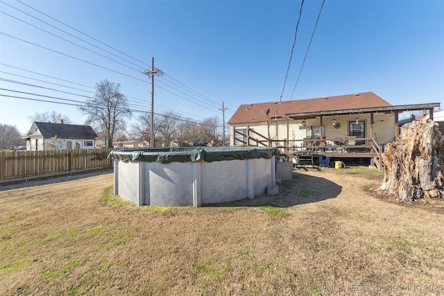 view of yard featuring a swimming pool side deck