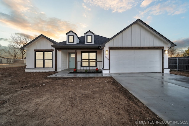 view of front of house with a garage and covered porch