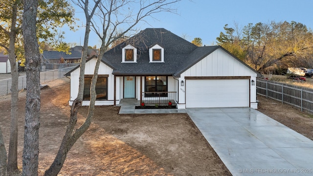 view of front of home featuring a porch and a garage