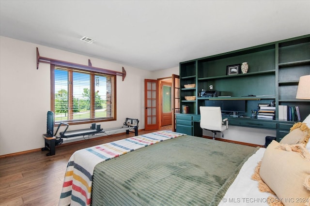 bedroom with wood-type flooring