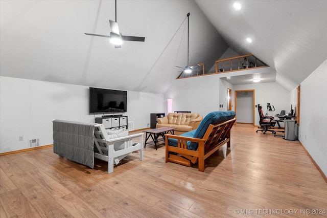 living room with light wood-type flooring, ceiling fan, and lofted ceiling