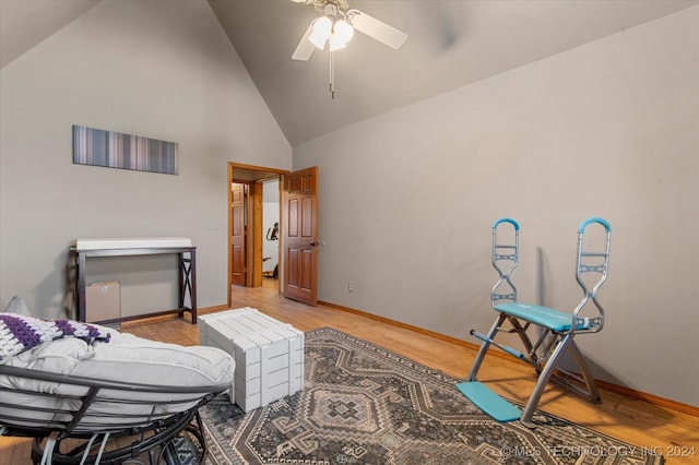 interior space featuring light wood-type flooring, high vaulted ceiling, and ceiling fan