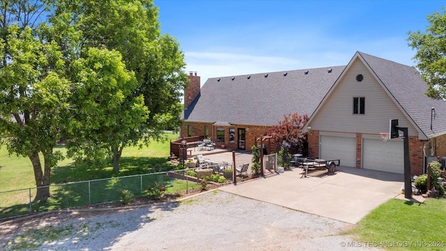 view of front of home with a garage and a front yard