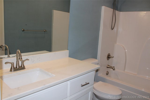 full bathroom with shower / bathing tub combination, vanity, and toilet