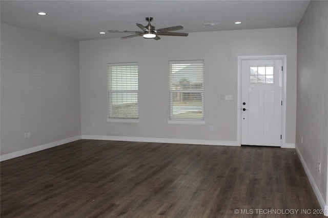 foyer with ceiling fan and dark wood-type flooring