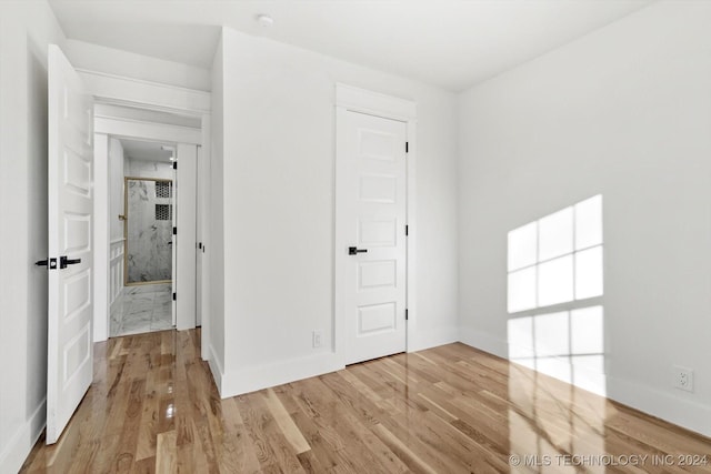 spare room featuring light hardwood / wood-style flooring