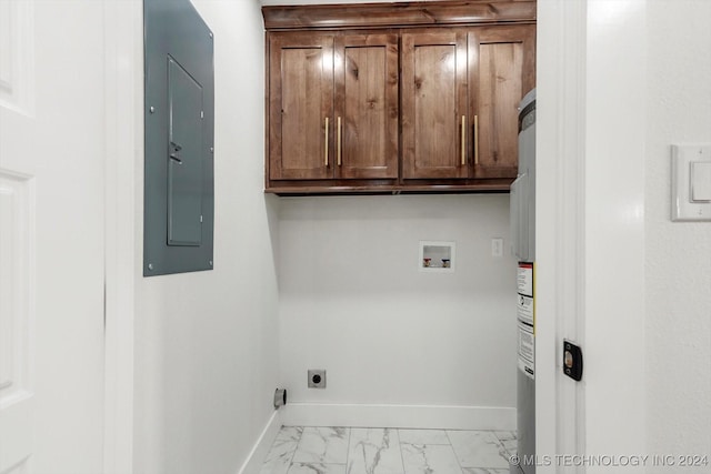 laundry area featuring electric dryer hookup, electric panel, hookup for a washing machine, and cabinets