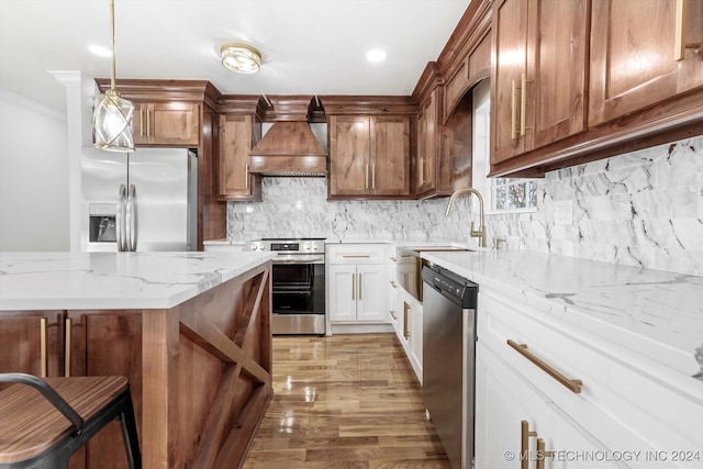 kitchen featuring light stone countertops, white cabinetry, stainless steel appliances, light hardwood / wood-style flooring, and custom range hood