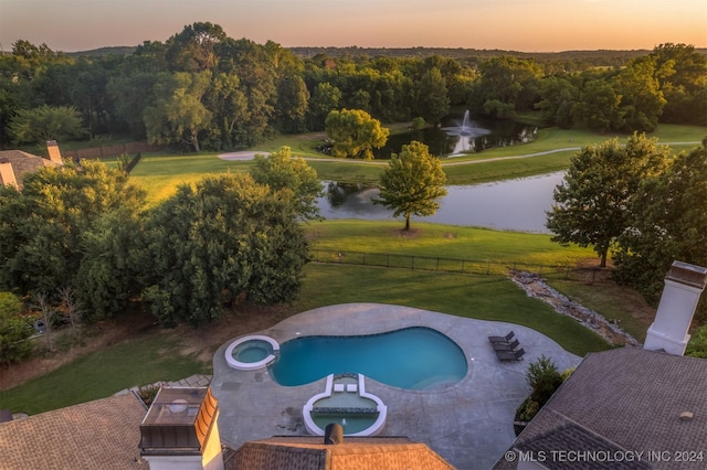 3520 W 77th St S, Tulsa, OK 74132 - view of swimming pool with a water view, a pool with connected hot tub, and a patio