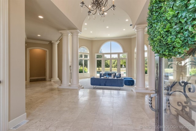 3520 W 77th St S, Tulsa, OK 74132 - entrance foyer featuring recessed lighting, crown molding, ornate columns, arched walkways, and a high ceiling