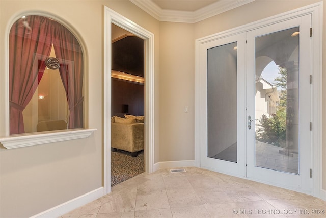 doorway featuring ornamental molding