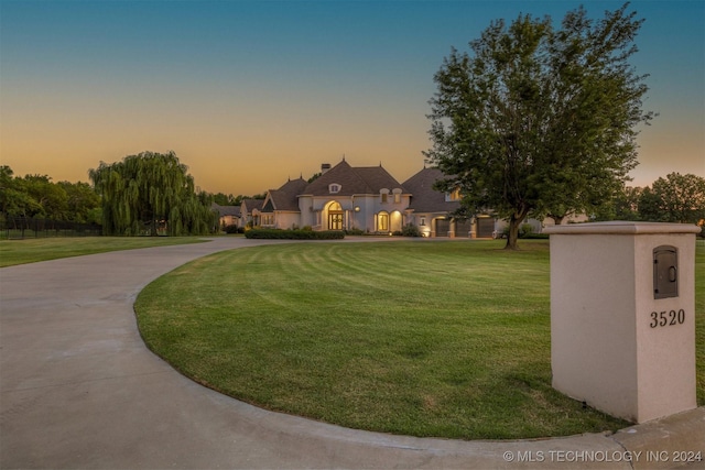 3520 W 77th St S, Tulsa, OK 74132 - view of community with curved driveway and a lawn